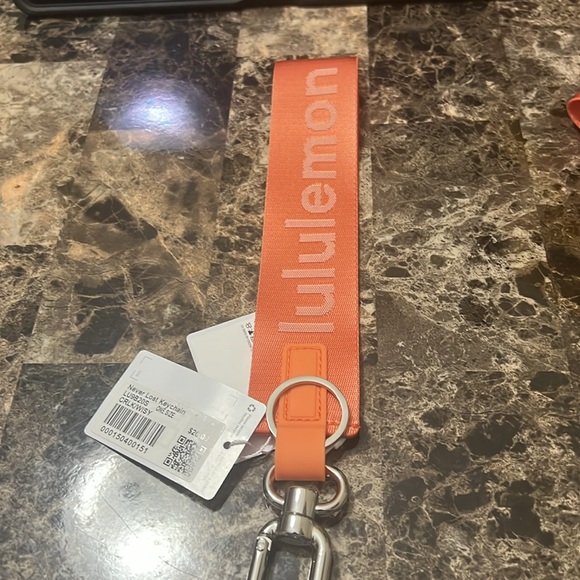 LULULEMON NEVER LOST KEYCHAIN ORANGE COLOR NWT - Picture 4 of 4